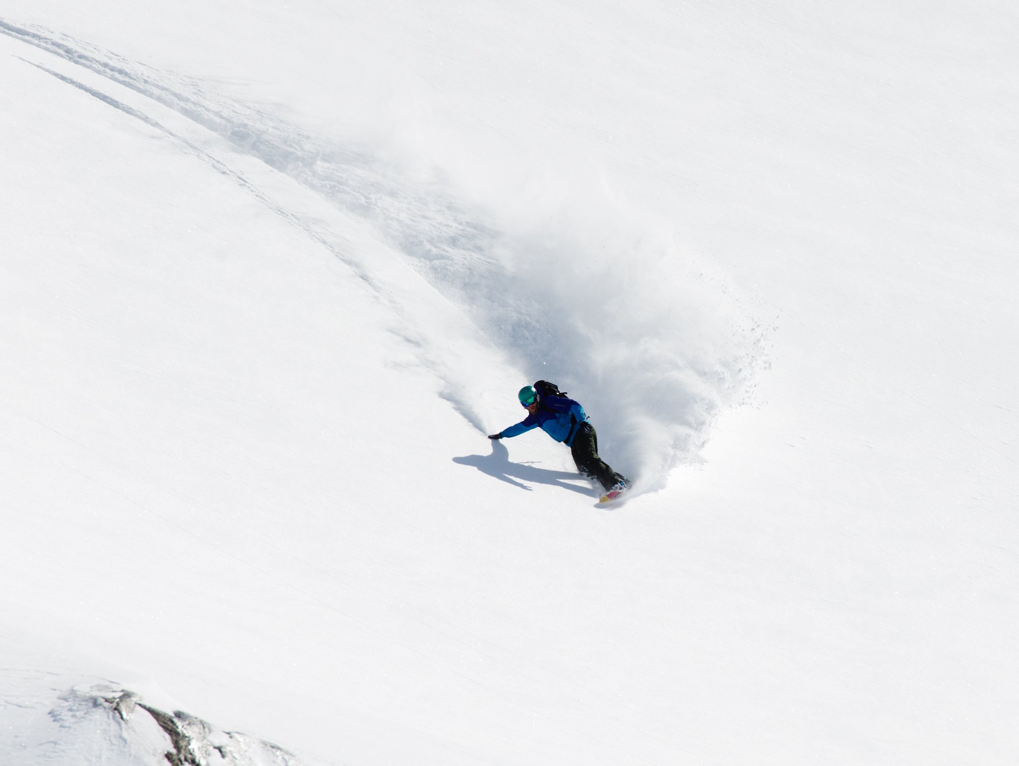 Deep Powder days on a custom, Savage Panda Snowboard Photo by Vince Shuley